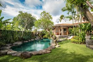 a pool in the backyard of a house at Casa Mila - 4BR Luxury Villa 5 Min from Canggu Beach in Canggu