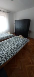 Posteľ alebo postele v izbe v ubytovaní Apartments Valiza III Large apartment - 3 bedrooms and parking space i Apartments Valiza IV