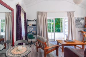 a living room with a couch and a table at The Earthy Inn in Greyton