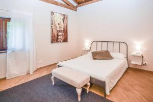 En eller flere senge i et værelse på Relais delle Querce