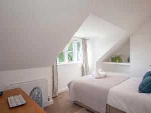 Voodi või voodid majutusasutuse Tokenhill Cottage toas