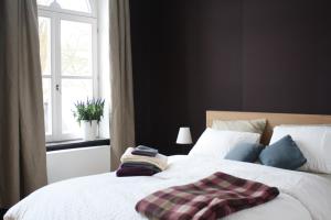 Postel nebo postele na pokoji v ubytování B&B Les Dépendances