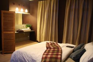 Postel nebo postele na pokoji v ubytování B&B Les Dépendances