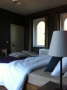 Postel nebo postele na pokoji v ubytování B&B Les Dépendances