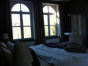 Postel nebo postele na pokoji v ubytování B&B Les Dépendances