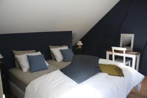 Postel nebo postele na pokoji v ubytování B&B Les Dépendances
