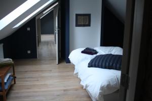 Postel nebo postele na pokoji v ubytování B&B Les Dépendances