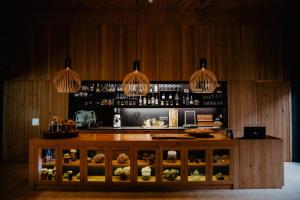 a counter in a restaurant with lights above it at Furnas Lake Forest Living in Furnas