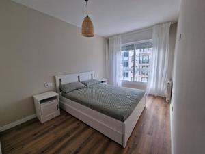 Posteľ alebo postele v izbe v ubytovaní BAIONA PLAYA