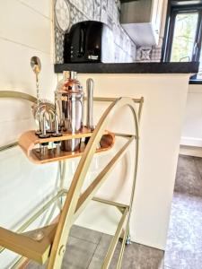 a table in a kitchen with a coffee maker on it at Magpie 2 Hot Tub HuntersMoon-Warminster-Longleat-Wiltshire in Warminster