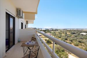 a balcony with a table and a view at Apartamento Serra e Mar in Alvor