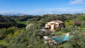 an aerial view of a house with a swimming pool at La Villa nell'Isola Verde 12, Emma Villas in Casciana Terme