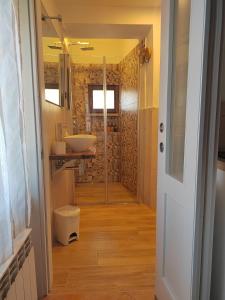 a bathroom with a sink and a mirror at Serendipity House in Grosseto