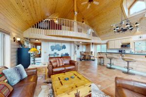 a living room with a couch and a table at Peak View Vista in Florissant