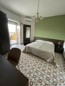 Krevet ili kreveti u jedinici u objektu Hotel il Rosone