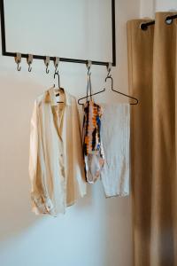 a group of clothes hanging on a rack at Pyramidenkogel Lodge in Keutschach am See