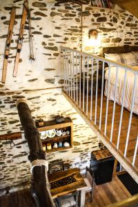 a staircase in a room with skis on the wall at il Bosco in Roccaforte Mondovì