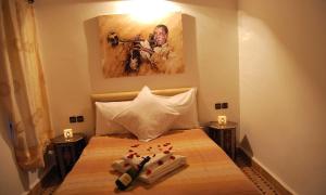 Postel nebo postele na pokoji v ubytování Hotel Riad Todos