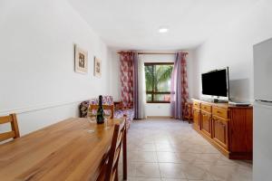 TV a/nebo společenská místnost v ubytování Apartamento Emeterio