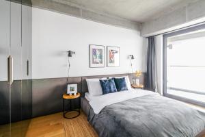 a bedroom with a large bed and a window at Chic and Scenic Studio Flat in Sisli in Istanbul
