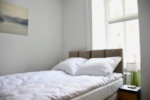 Łóżko lub łóżka w pokoju w obiekcie Narutowicza 5 Apartments