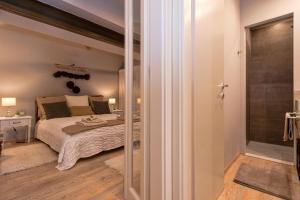 Postel nebo postele na pokoji v ubytování Heraclea Residential Apartments