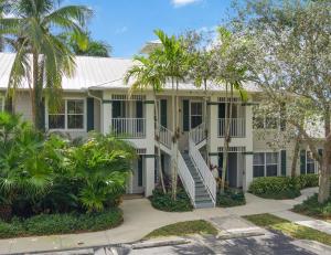a house with palm trees in front of it at Lely Greenlinks Top Floor - on Golf Course, Minutes from Beaches, Downtown! in Naples