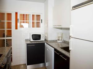 Kuchyň nebo kuchyňský kout v ubytování Caoca A6 Apartamento con vistas privilegiadas