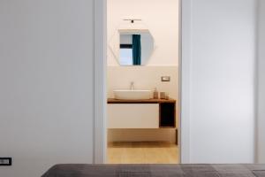 a bathroom with a sink and a mirror at Maison Lorelle Sorrento in Sorrento