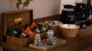 a table with two baskets and a box of food at Hôtel Vauban in Le Palais