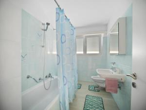 Koupelna v ubytování Caslano City Apartments + 8 fotografií