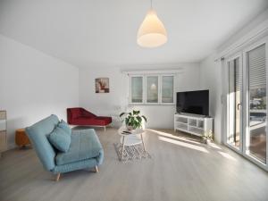 TV a/nebo společenská místnost v ubytování Caslano City Apartments