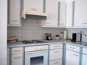 Kuchyň nebo kuchyňský kout v ubytování Caslano City Apartments