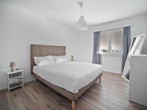 Postel nebo postele na pokoji v ubytování Caslano City Apartments