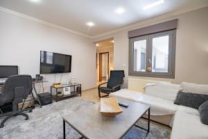 a living room with a couch and a table at Rafina 1 bedroom 2 persons apartment by MPS in Rafina