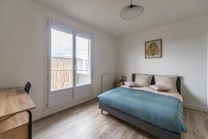 Posteľ alebo postele v izbe v ubytovaní Le Forestier - Balcon - Arrivée Autonome