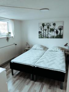 Tempat tidur dalam kamar di Landstedet Billund