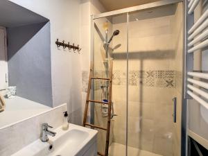 a bathroom with a shower and a sink at Ferme Gascone proche Marciac in Bars