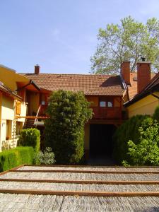 a house with a garage in front of it at Lunczer Vendégház in Mosonmagyaróvár