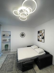 En eller flere senge i et værelse på Appartement centre-ville