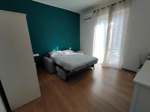 Ένα ή περισσότερα κρεβάτια σε δωμάτιο στο Aura Apartment Bari