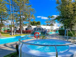 a water park with a pool and a slide at Bungalows Cordial Biarritz in Playa del Ingles