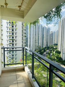 a balcony with a view of tall buildings at Sea&CityView 2-bedroom Fully Furnished Apartment Forest City #freeWIFI in Gelang Patah