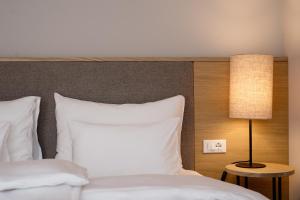 Postel nebo postele na pokoji v ubytování Hotel Schwarzschmied