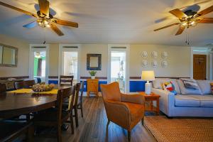 a living room with a table and a couch at La Posada in Milford