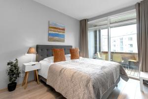 Postel nebo postele na pokoji v ubytování Tower Apartments