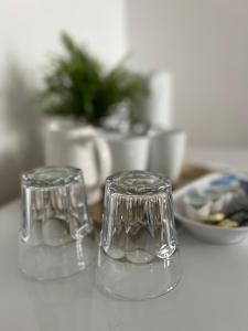 two clear glasses sitting on top of a table at Mayfair Guest House in Cardiff