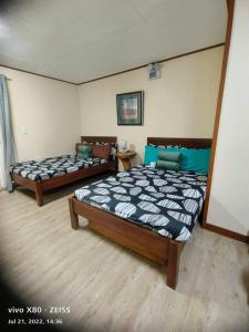 En eller flere senge i et værelse på Zenmist properties - Studio Unit