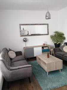 a living room with a couch and a coffee table at Apartment Wigo in Feldkirchen in Kärnten