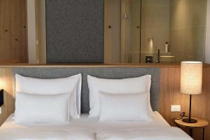 Postel nebo postele na pokoji v ubytování Hotel Schwarzschmied